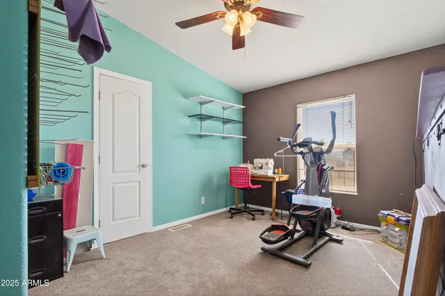 a bathroom with a shower curtain and a toilet