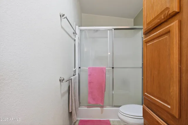 a view of a balcony with chairs