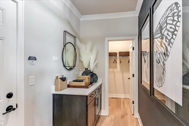 a bathroom with a sink a mirror and a shower