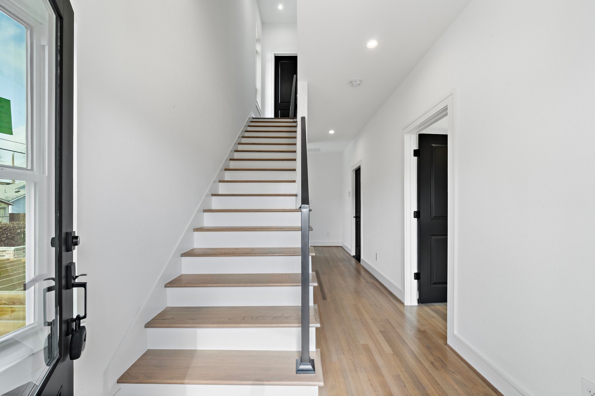 1005 East 28th Street Houston, TX 77009 - Photo 1 of 35 a view of an entryway with wooden floor