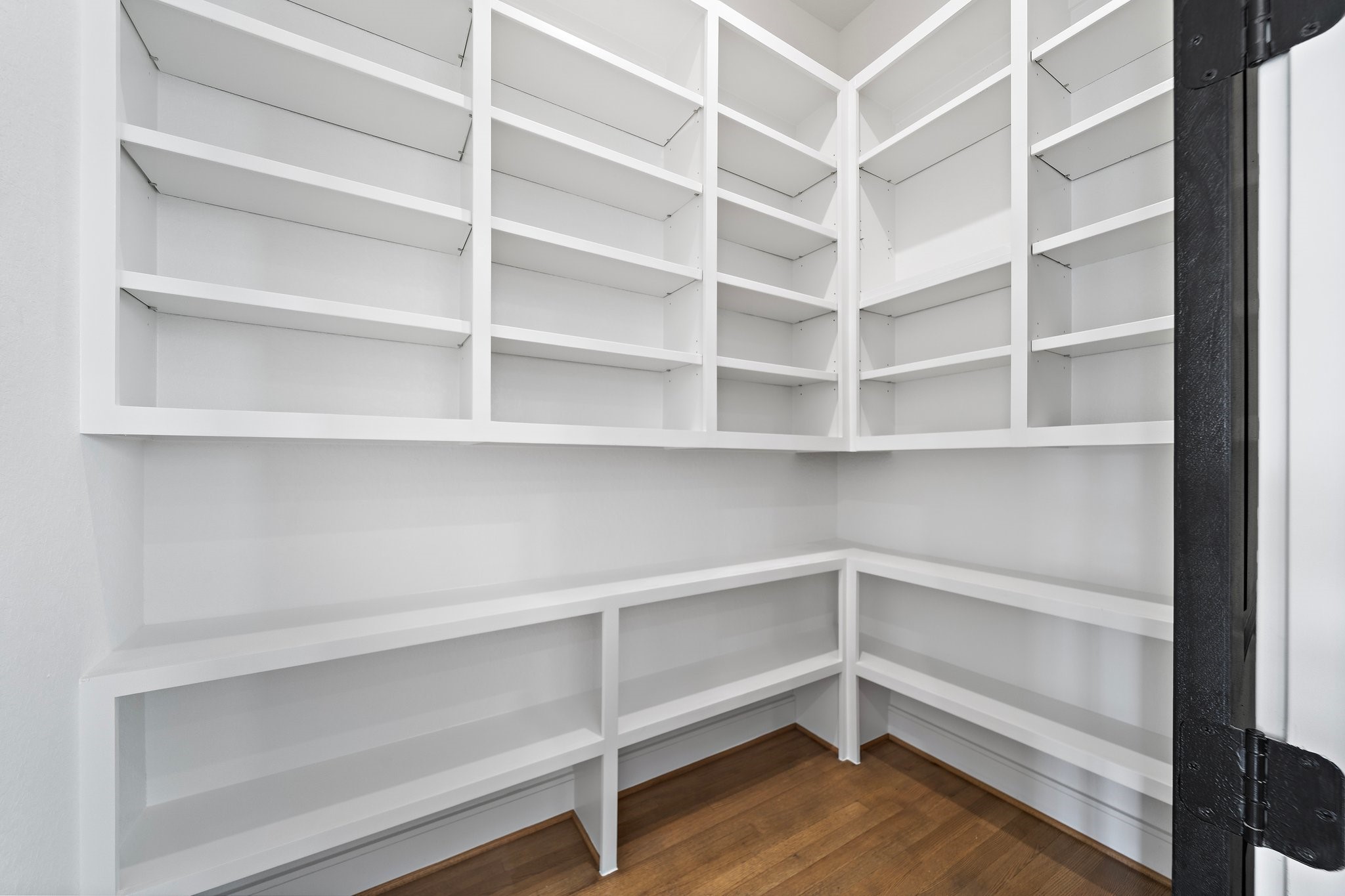 1005 East 28th Street Houston, TX 77009 - Photo 15 of 35 a view of walk in closet with empty racks