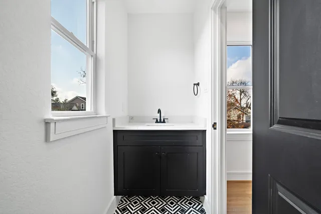 a bathroom with a sink and a mirror