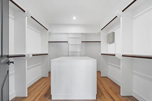 a utility room with cabinets washer and dryer