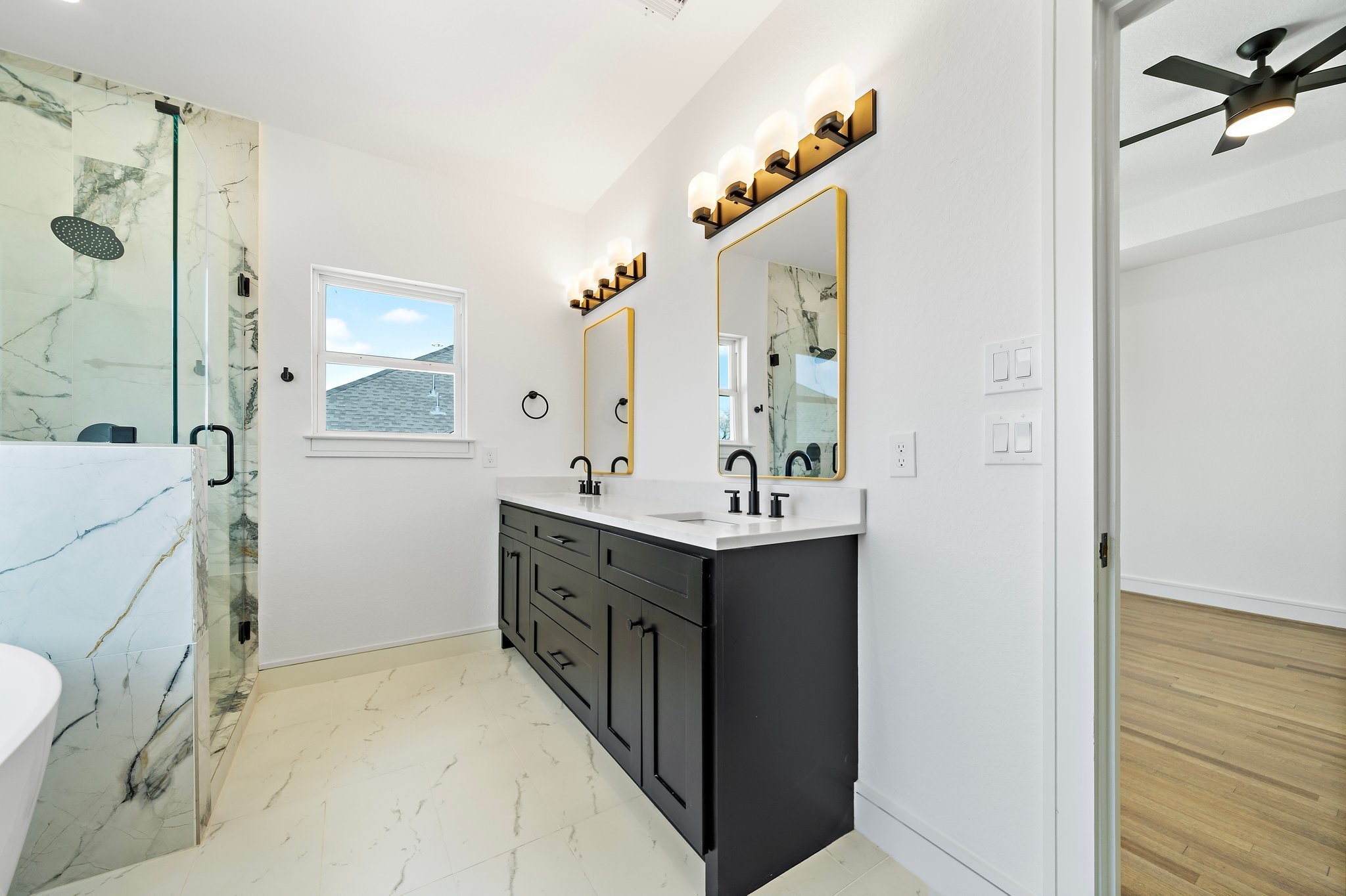 1005 East 28th Street Houston, TX 77009 - Photo 24 of 35 a bathroom with a double vanity sink mirror and shower