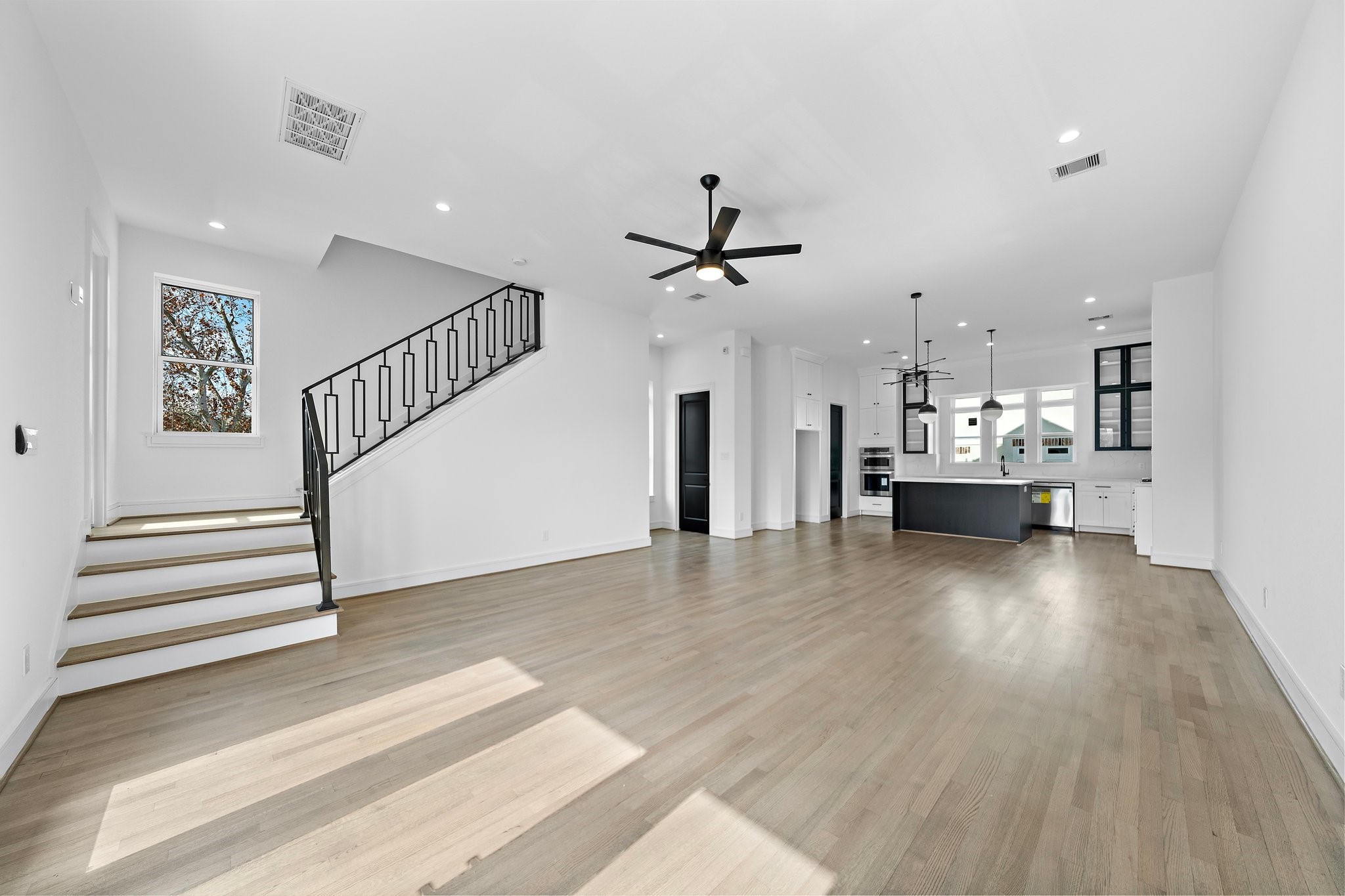 1005 East 28th Street Houston, TX 77009 - Photo 30 of 35 a view of a kitchen with a sink and a floor to ceiling window