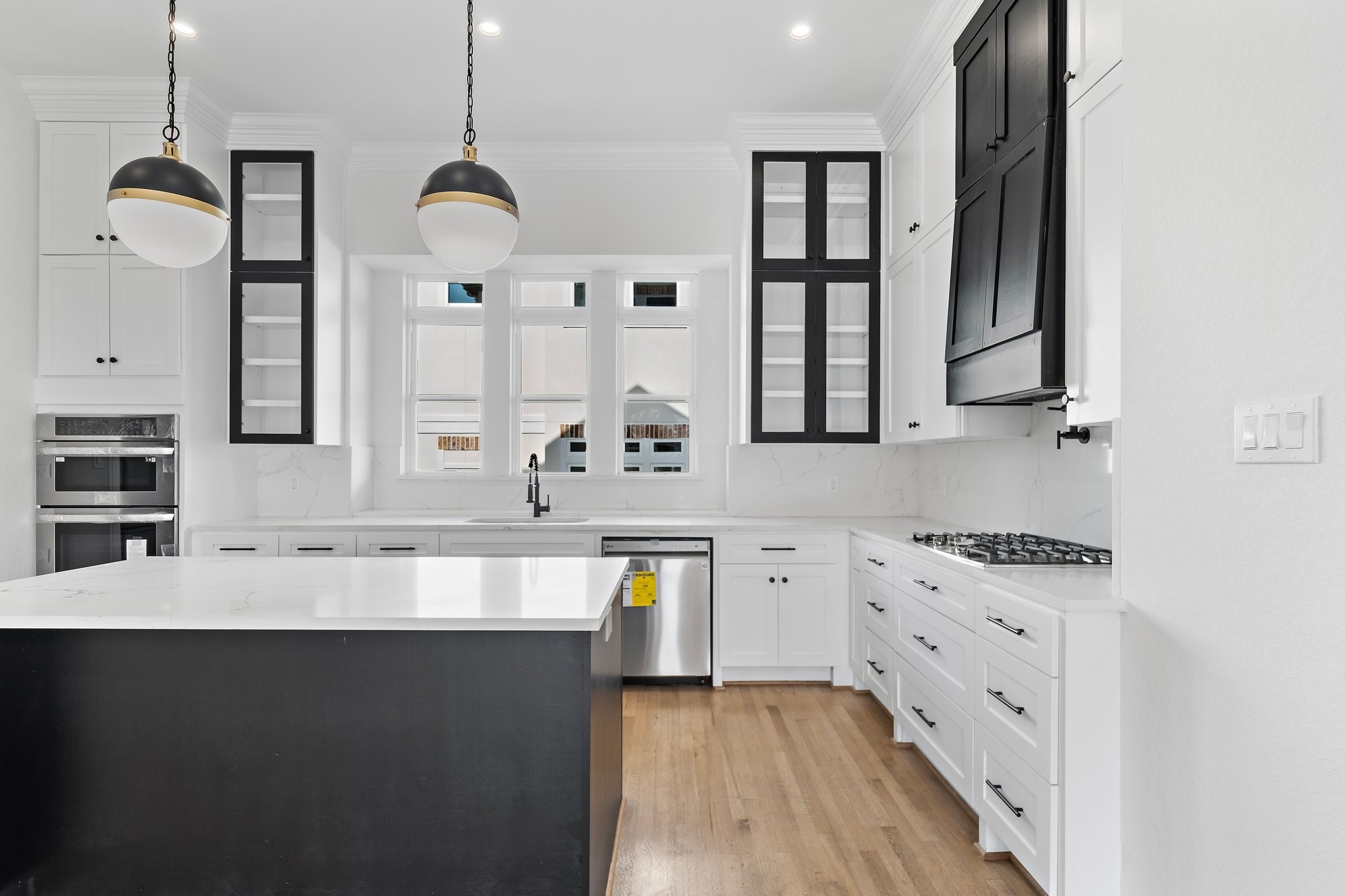1005 East 28th Street Houston, TX 77009 - Photo 5 of 35 a large kitchen with granite countertop a sink a stove and dishwasher