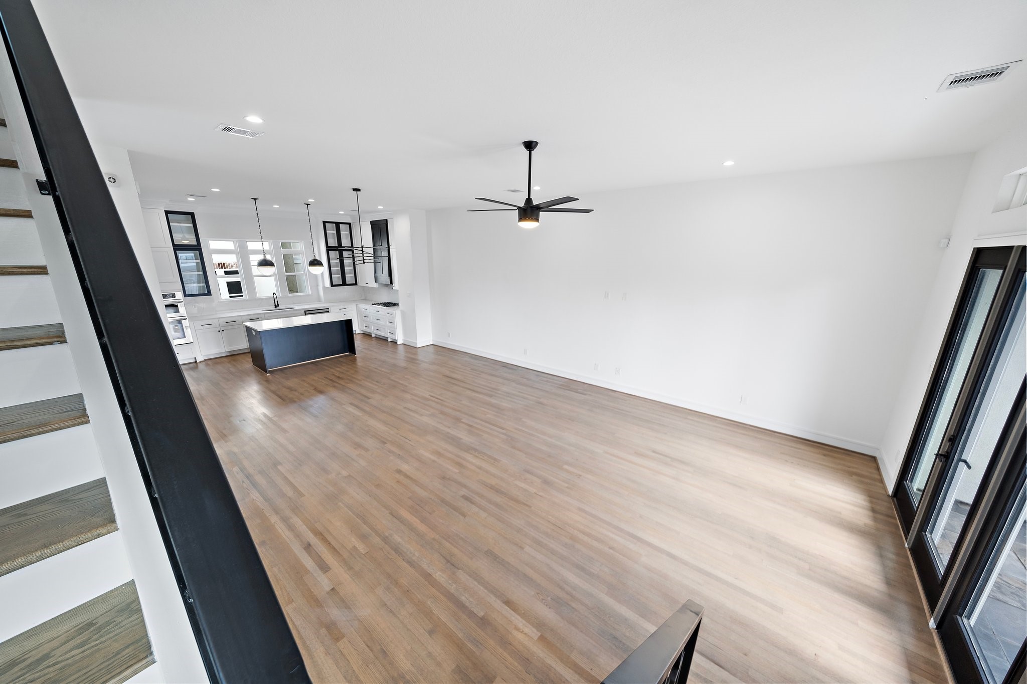 1005 East 28th Street Houston, TX 77009 - Photo 9 of 35 wooden floor in an empty room with a fireplace