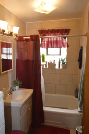 a bathroom with a bathtub and a shower
