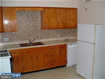 121-123 West Washington Street Riverside, NJ 08075 - Photo 5 of 6 a bathroom with a sink and a mirror