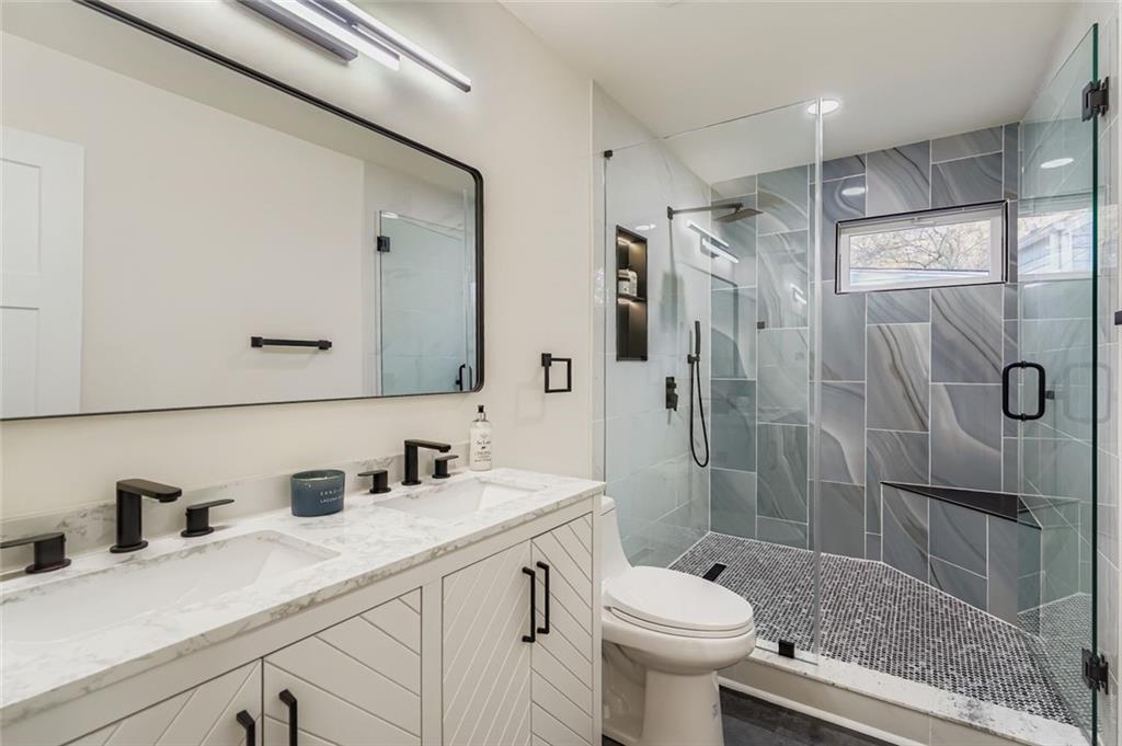 194 Dearborn Street Southeast Atlanta, GA 30317 - Photo 20 of 25 a bathroom with a sink a toilet and shower