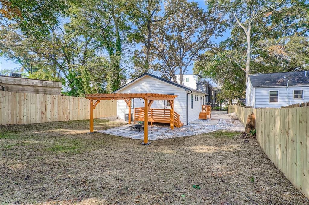 194 Dearborn Street Southeast Atlanta, GA 30317 - Photo 24 of 25 a view of a house with a yard