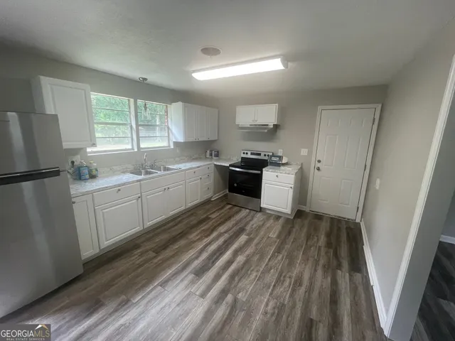a view of wooden floor in an empty room