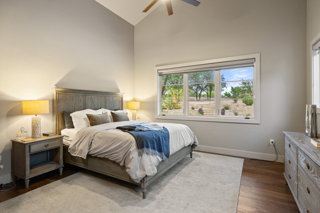 2560 Bell Springs Road Dripping Springs, TX 78620 - Photo 27 of 40 a bedroom with a bed and a window