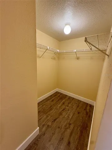 a view of a balcony with wooden floor