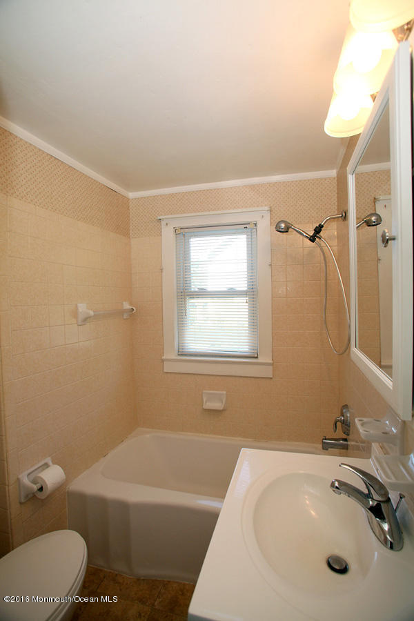 948 Adelphia Road Freehold, NJ 07728 - Photo 5 of 15 a bathroom with a sink a toilet and shower