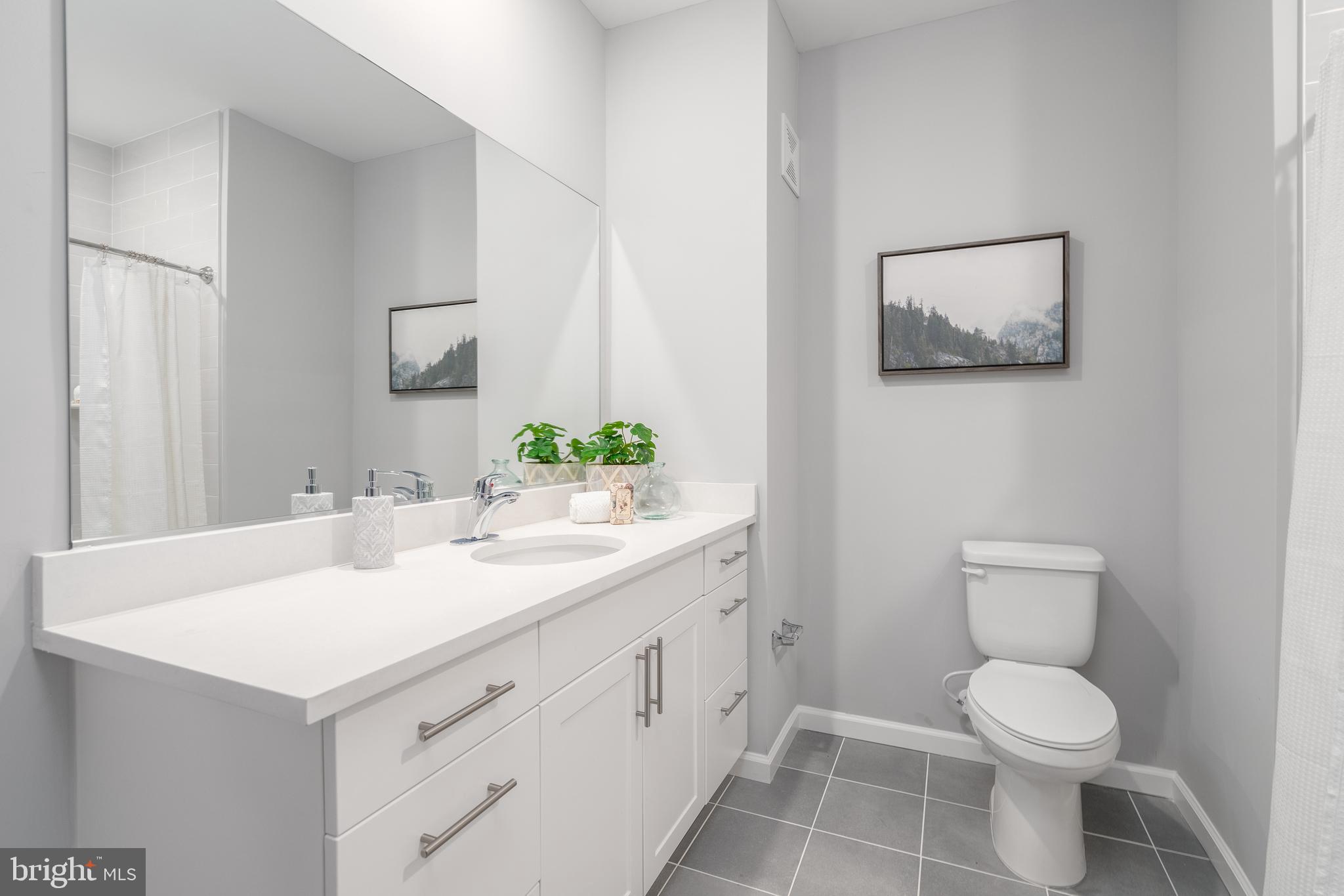 700 Citation Lane, Unit 1249 Cherry Hill, NJ 08002 - Photo 20 of 33 a bathroom with a toilet sink and mirror