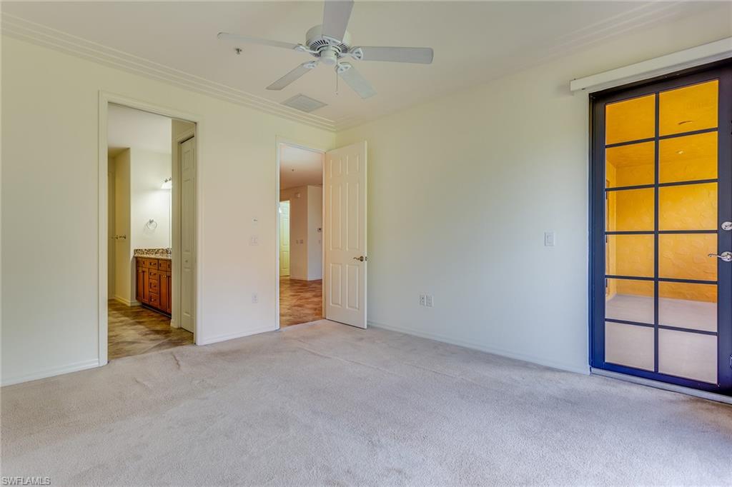 9037 Alturas Street, Unit 372 Naples, FL 34113 - Photo 11 of 23 an empty room with windows and closet