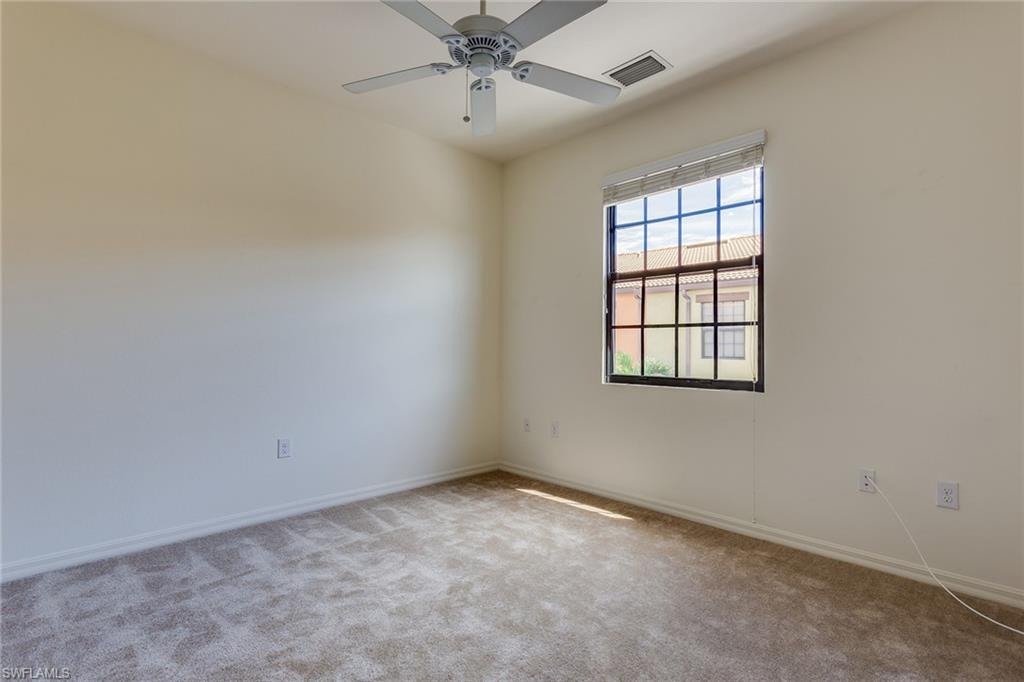 9037 Alturas Street, Unit 372 Naples, FL 34113 - Photo 17 of 23 an empty room with a window