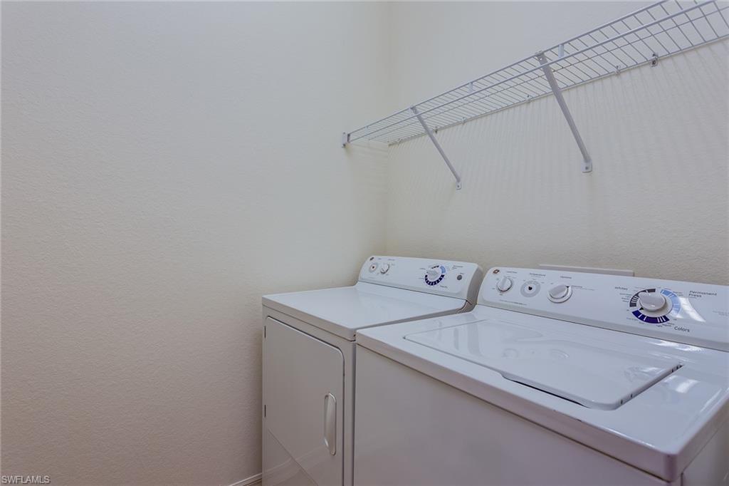 9037 Alturas Street, Unit 372 Naples, FL 34113 - Photo 21 of 23 a utility room with dryer and washer