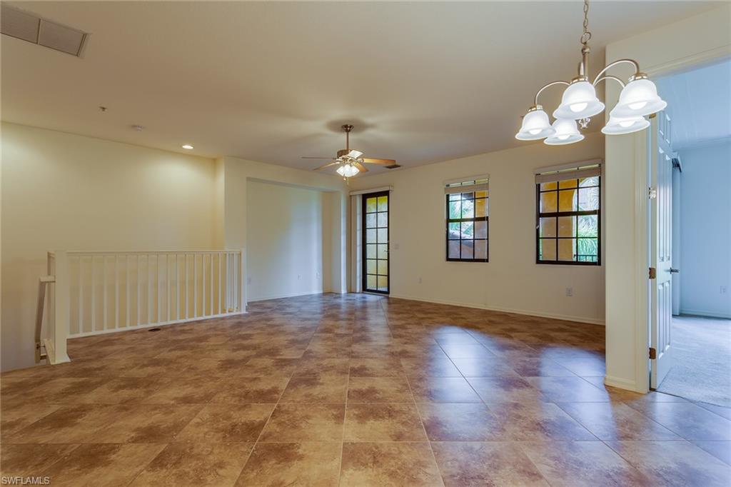 9037 Alturas Street, Unit 372 Naples, FL 34113 - Photo 3 of 23 a view of a livingroom with a chandelier fan and windows