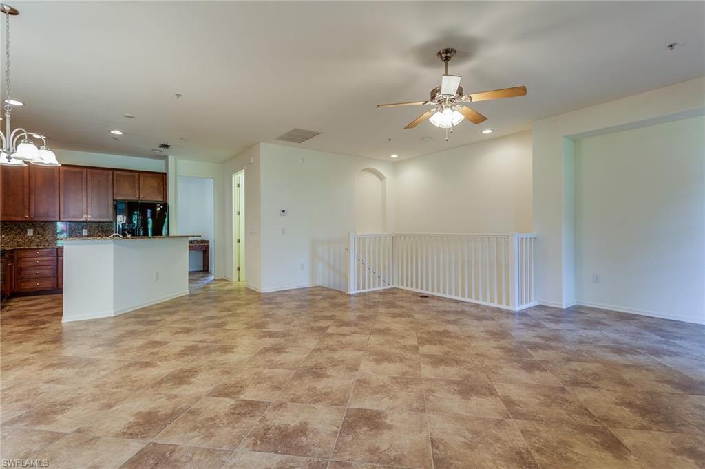 9037 Alturas Street, Unit 372 Naples, FL 34113 - Photo 5 of 23 a view of a kitchen with a sink and a refrigerator