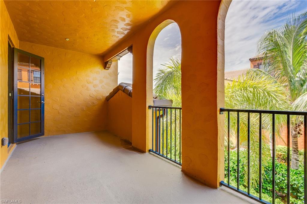 9037 Alturas Street, Unit 372 Naples, FL 34113 - Photo 7 of 23 a view of an entryway with wooden floor
