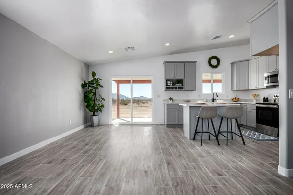 a kitchen with a table and chairs in it