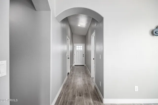 a kitchen with a sink a counter top space stainless steel appliances and cabinets