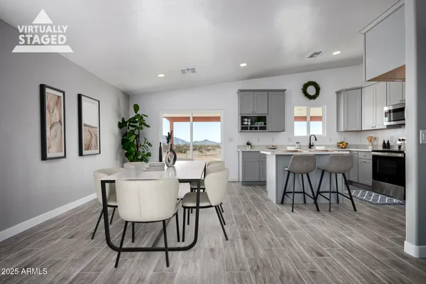 a kitchen with stove and refrigerator