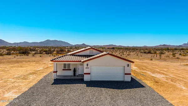 a front view of a house with a ocean view