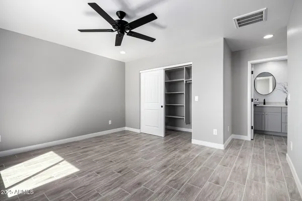 a view of an empty room and wooden floor