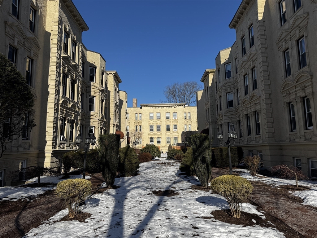 1870 Beacon Street, Unit 54 Brookline, MA 02445 - Photo 11 of 13 a view of a street with tall buildings