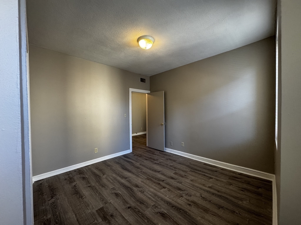 1870 Beacon Street, Unit 54 Brookline, MA 02445 - Photo 7 of 13 a view of an empty room