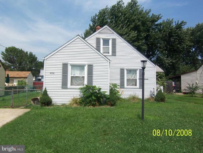 8126 Cornwall Road Dundalk, MD 21222 - Photo 1 of 1 a front view of a house with a yard