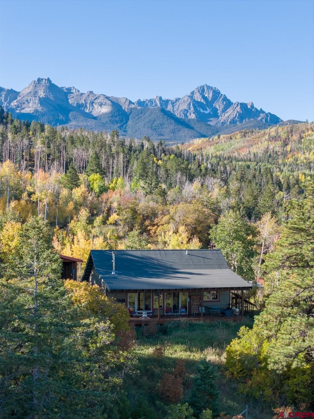 444 Which Way Ridgway, CO 81432 - Photo 1 of 36 a view of a house with a mountain yard and a lake view