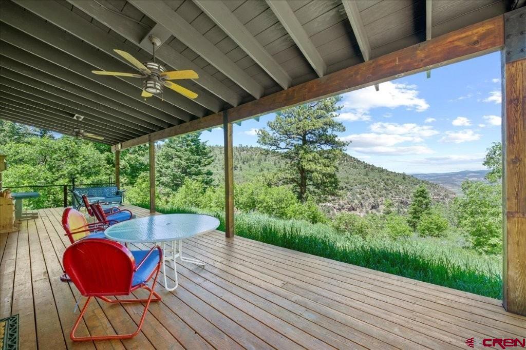 444 Which Way Ridgway, CO 81432 - Photo 19 of 36 a view of balcony with wooden floor and outdoor seating