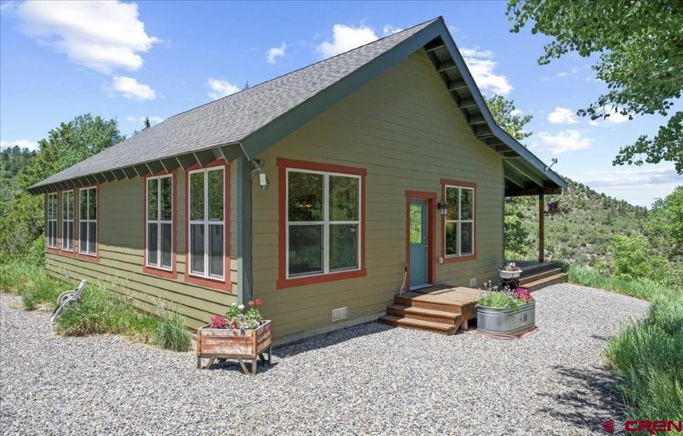 444 Which Way Ridgway, CO 81432 - Photo 8 of 36 a backyard of a house with outdoor seating