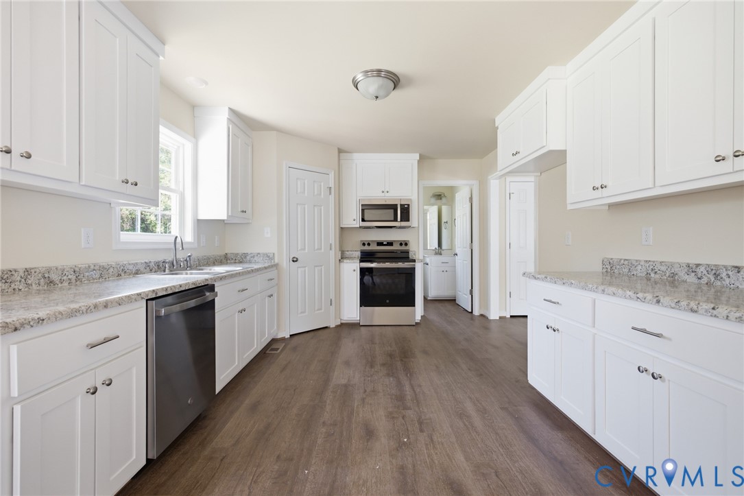 8440 Railroad Bed Road Carson, VA 23830 - Photo 36 of 39 Kitchen featuring white cabinetry, stainless steel