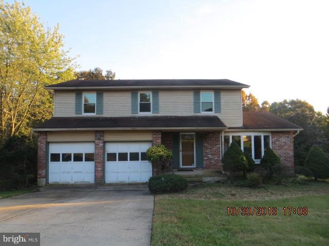 6923 Pinecrest Road Baltimore, MD 21228 - Photo 1 of 14 a front view of a house with a garden