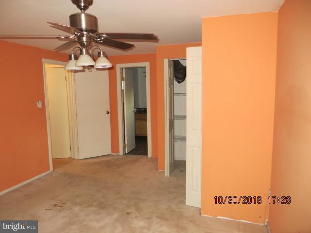 6923 Pinecrest Road Baltimore, MD 21228 - Photo 12 of 14 a view of a hallway with a yellow space