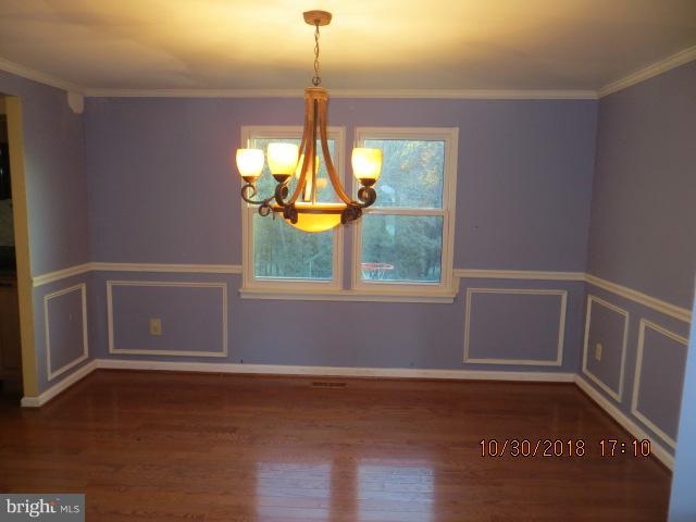 6923 Pinecrest Road Baltimore, MD 21228 - Photo 13 of 14 a view of an empty room with a window