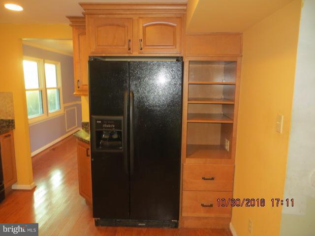 6923 Pinecrest Road Baltimore, MD 21228 - Photo 3 of 14 a view of walk in closet with empty racks