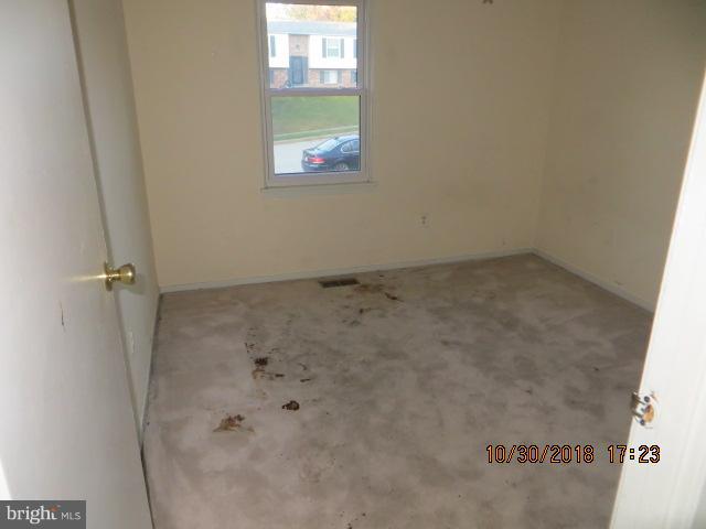 6923 Pinecrest Road Baltimore, MD 21228 - Photo 10 of 14 a view of bathroom with window