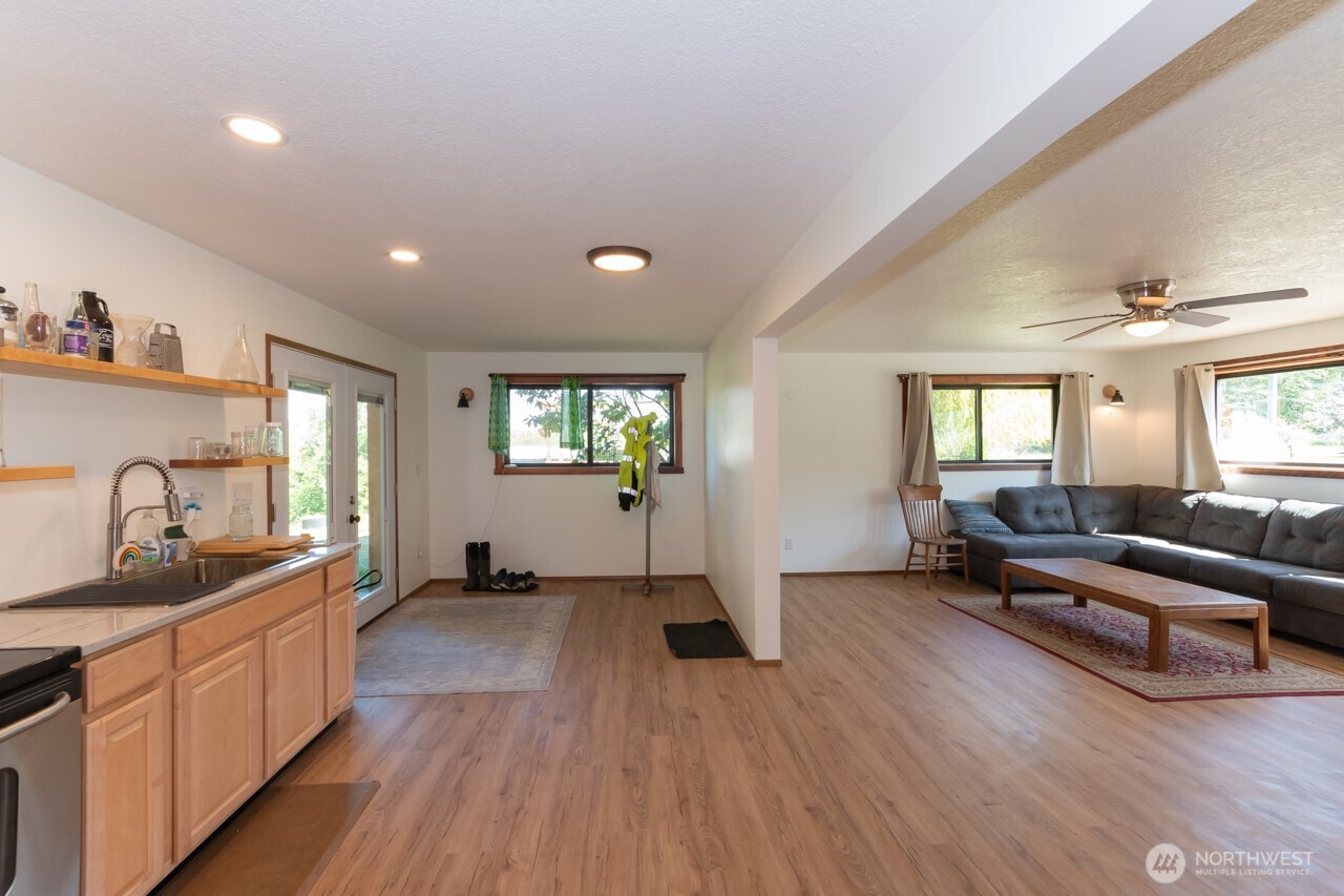 63 East Arnette Road Port Angeles, WA 98362 - Photo 18 of 40 a living room with furniture window and wooden floor