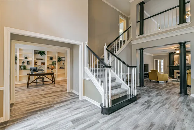 a view of entryway dining room and hall with wooden floor