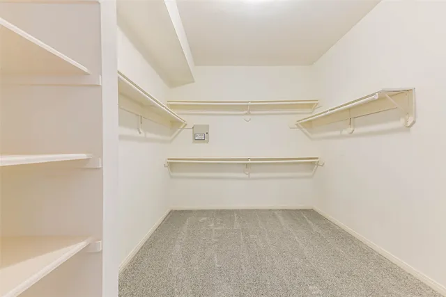 a view of an empty walk in closet