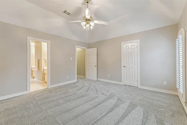a view of a livingroom with a chandelier fan