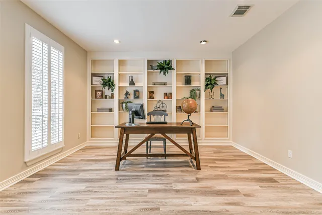 a view of a livingroom with furniture and wooden floor