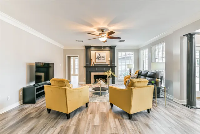 a living room with furniture and a fireplace