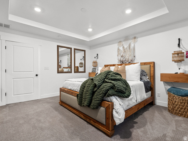 627 South Meade Street Mapleton, UT 84664 - Photo 14 of 48 Bedroom featuring a tray ceiling with recessed lighting, light gray carpet flooring, and a white two-panel door with black hardware